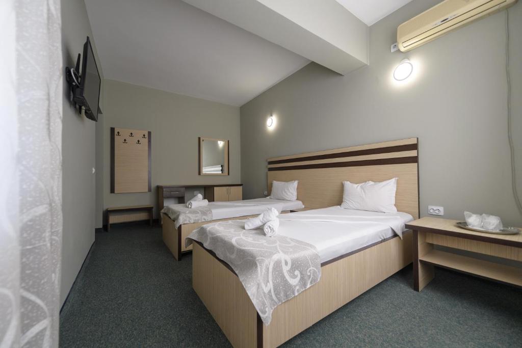 Postel nebo postele na pokoji v ubytování Hotel Cora