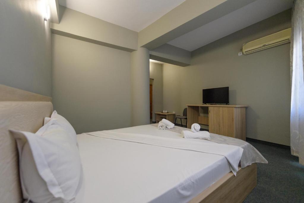 Postel nebo postele na pokoji v ubytování Hotel Cora