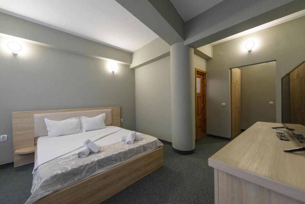 Postel nebo postele na pokoji v ubytování Hotel Cora
