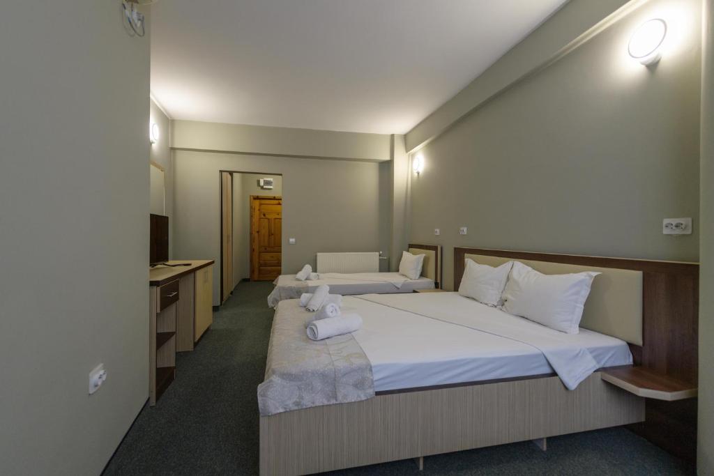 Postel nebo postele na pokoji v ubytování Hotel Cora