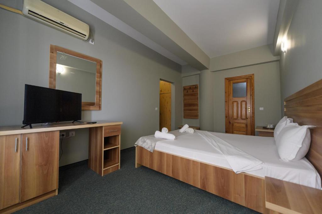 Postel nebo postele na pokoji v ubytování Hotel Cora