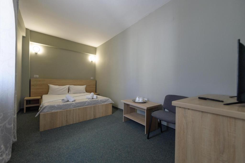 Postel nebo postele na pokoji v ubytování Hotel Cora