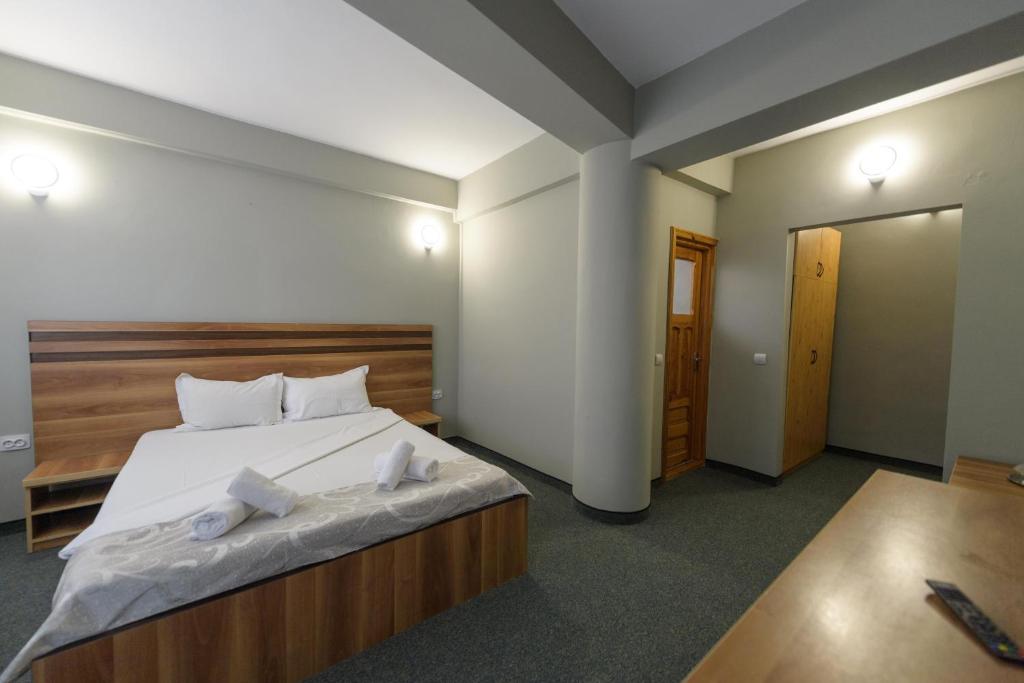 Postel nebo postele na pokoji v ubytování Hotel Cora