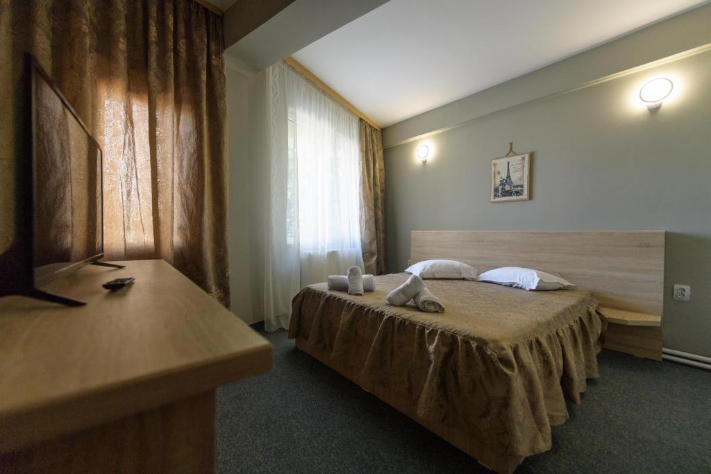 Postel nebo postele na pokoji v ubytování Hotel Cora