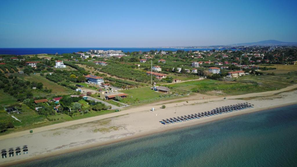 an aerial view of a beach next to the water at Seaview Aparthotel in Nea Potidaea