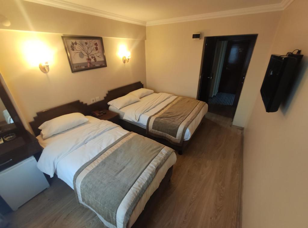 Postel nebo postele na pokoji v ubytování Hotel Akyildiz