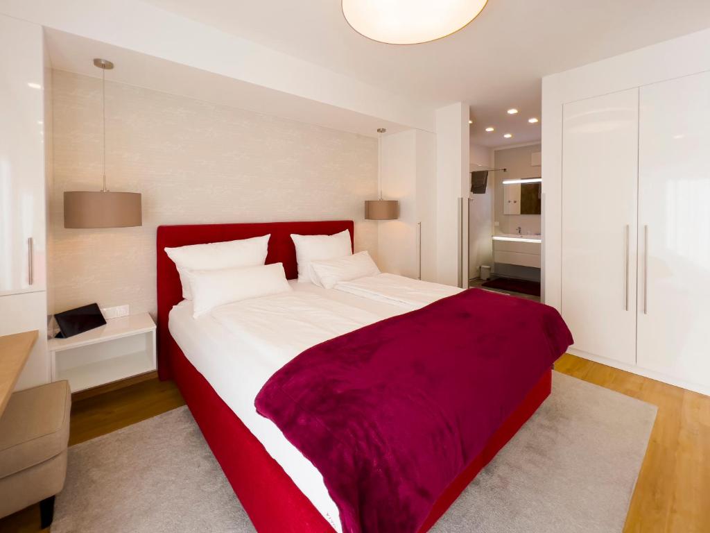 Postel nebo postele na pokoji v ubytování VIVA Apartments