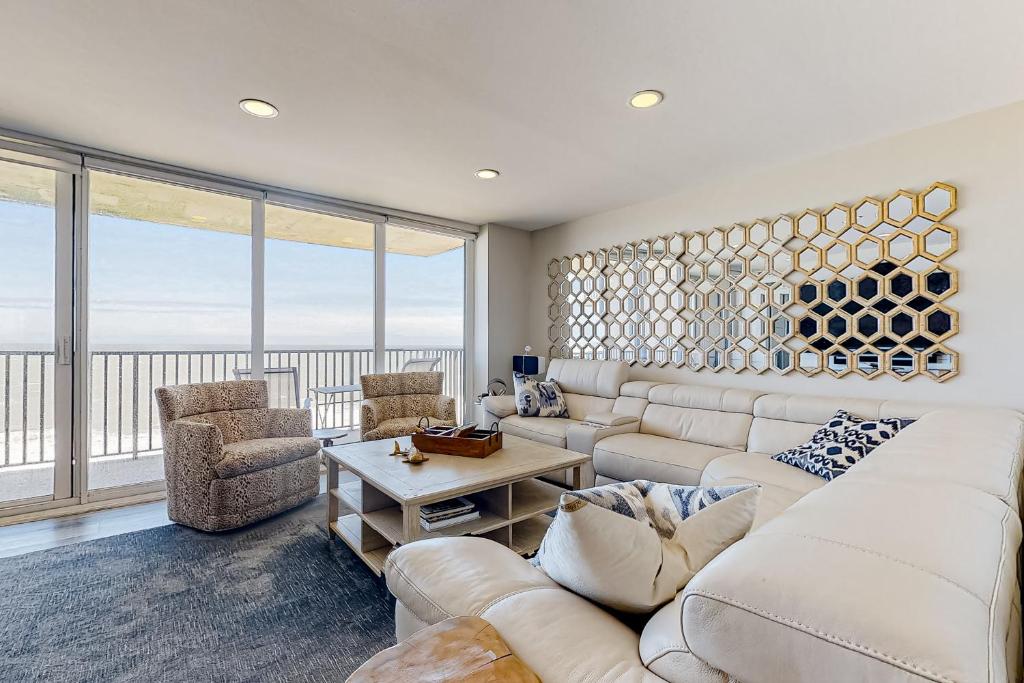 a living room with a couch and chairs and a large window at Sea Colony Ocean --- 1205N Edgewater House in Bethany Beach