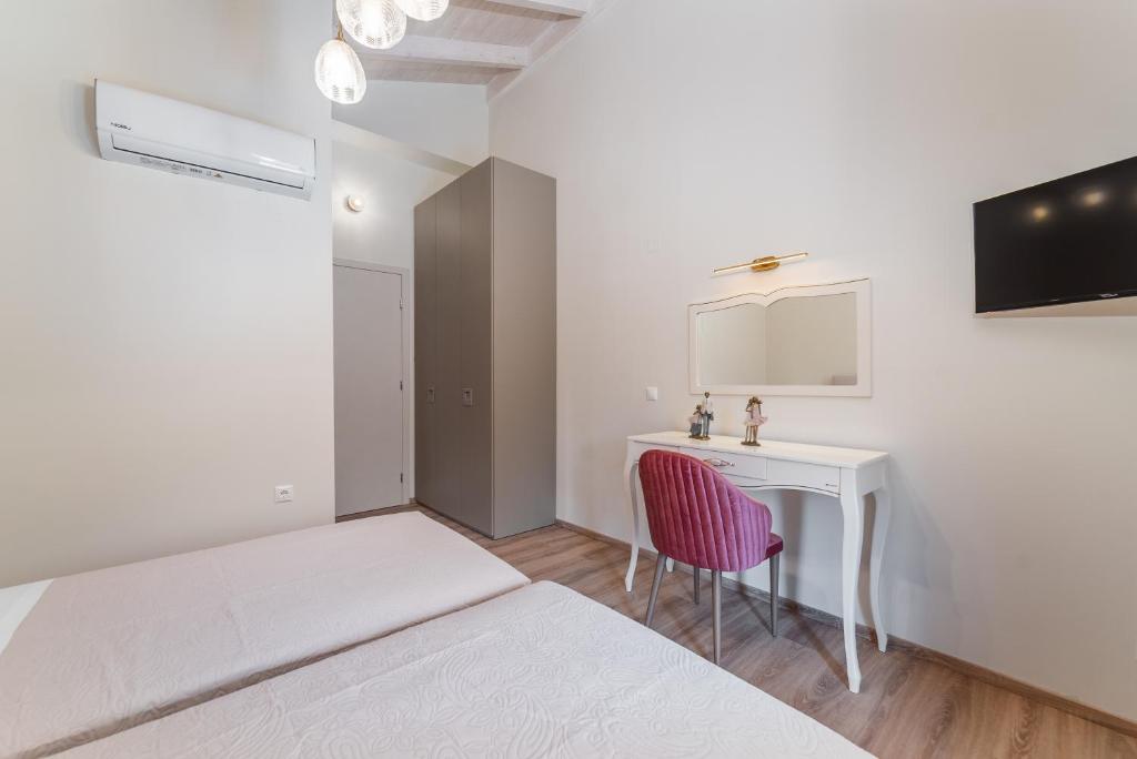 Posteľ alebo postele v izbe v ubytovaní Vincenzo Suites