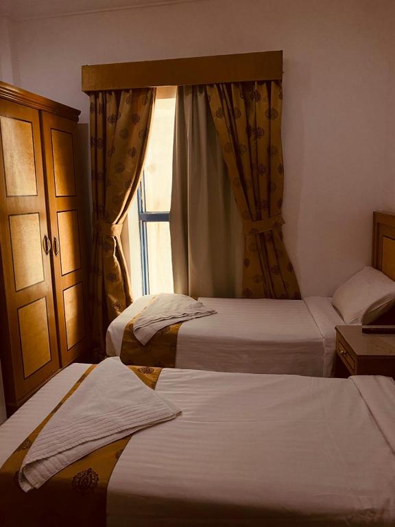 Postel nebo postele na pokoji v ubytování Hamad Saif Batal Hotel