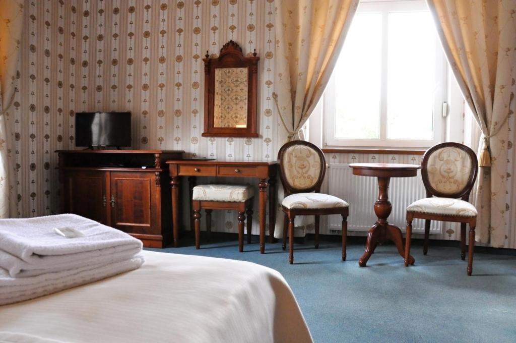 Posteľ alebo postele v izbe v ubytovaní Hotel MERTIN
