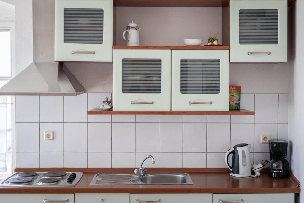 Kuchnia lub aneks kuchenny w obiekcie City Centar Apartments