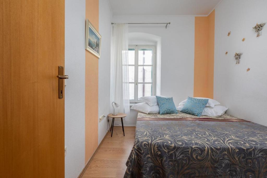 Łóżko lub łóżka w pokoju w obiekcie City Centar Apartments