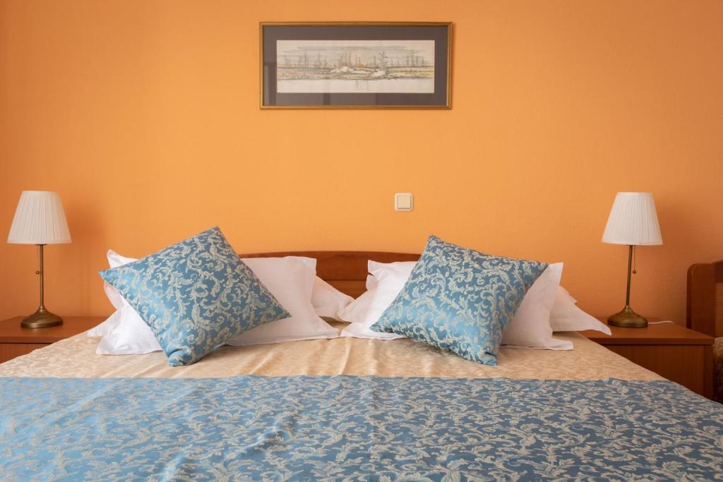 Łóżko lub łóżka w pokoju w obiekcie City Centar Apartments