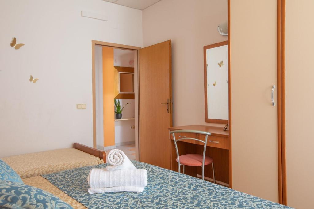 Łóżko lub łóżka w pokoju w obiekcie City Centar Apartments