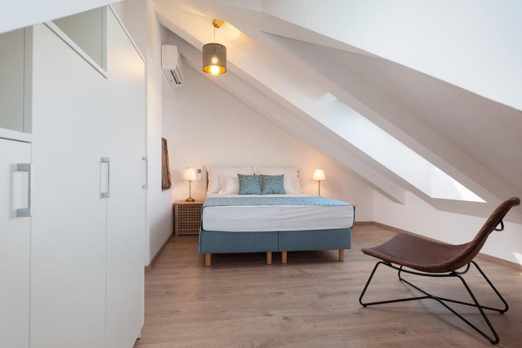 Łóżko lub łóżka w pokoju w obiekcie City Centar Apartments