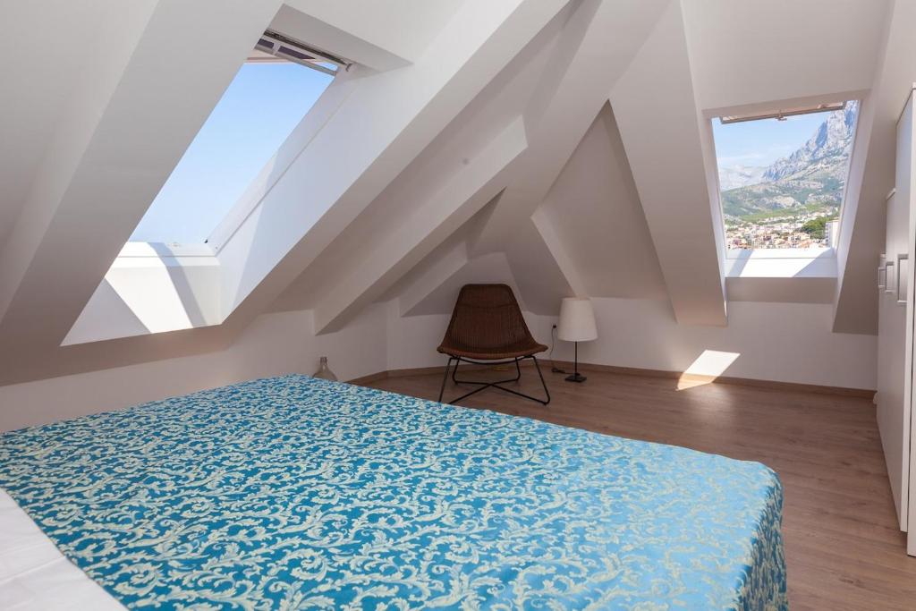 Łóżko lub łóżka w pokoju w obiekcie City Centar Apartments