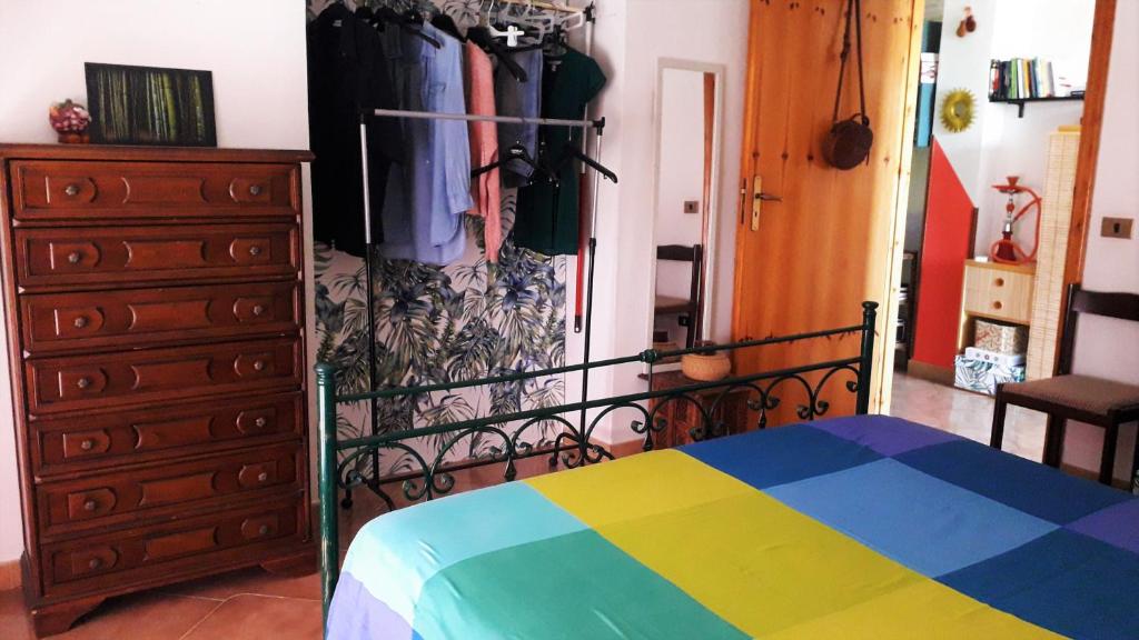 Postel nebo postele na pokoji v ubytování La Mansarda