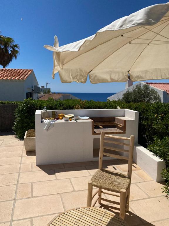 A balcony or terrace at BiniVento- Lovely villa with pool near the beach