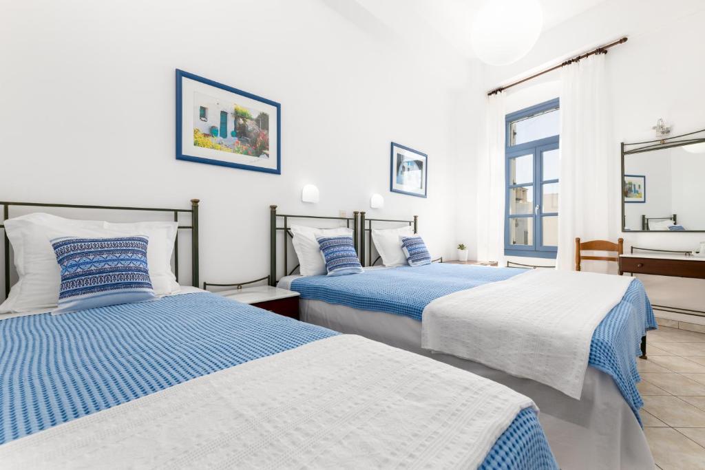 Postel nebo postele na pokoji v ubytování Hotel Dina