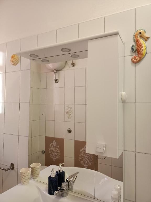 Kúpeľňa v ubytovaní Casa Ilanfra - appartamenti Gabbiano, Farfalla e Stella Marina