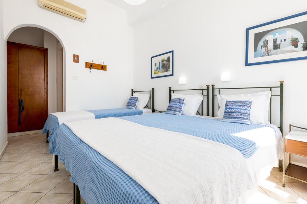 Postel nebo postele na pokoji v ubytování Hotel Dina
