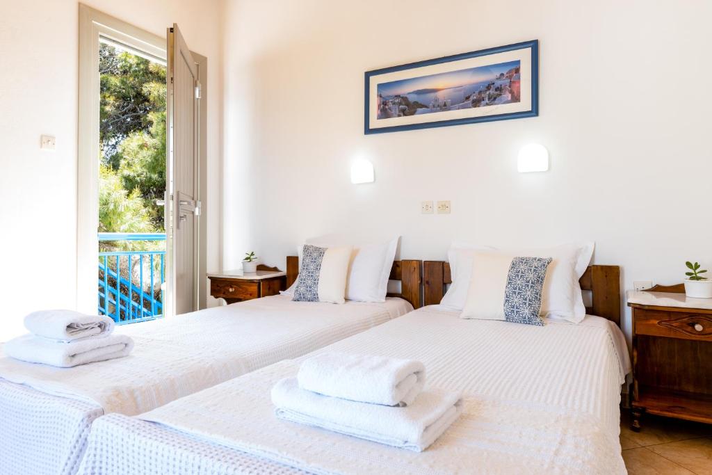 Postel nebo postele na pokoji v ubytování Hotel Dina