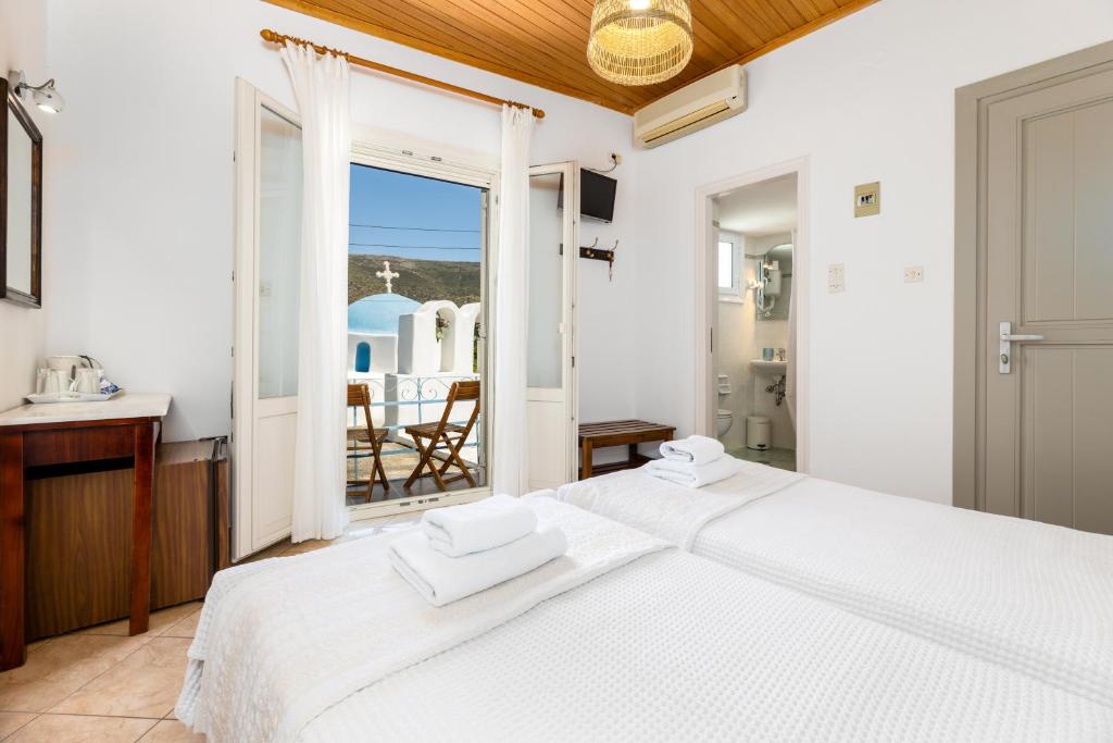 Postel nebo postele na pokoji v ubytování Hotel Dina