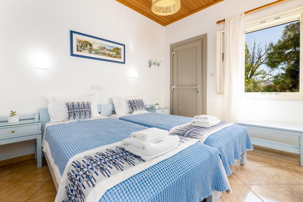 Postel nebo postele na pokoji v ubytování Hotel Dina