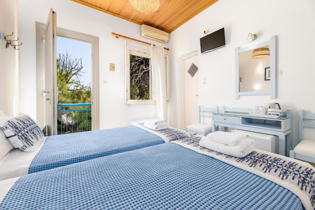 Postel nebo postele na pokoji v ubytování Hotel Dina