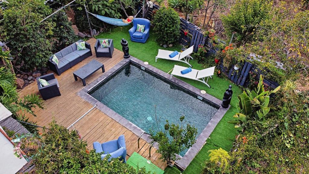 an aerial view of a backyard with a swimming pool at Fataga finca private with pool in Maspalomas