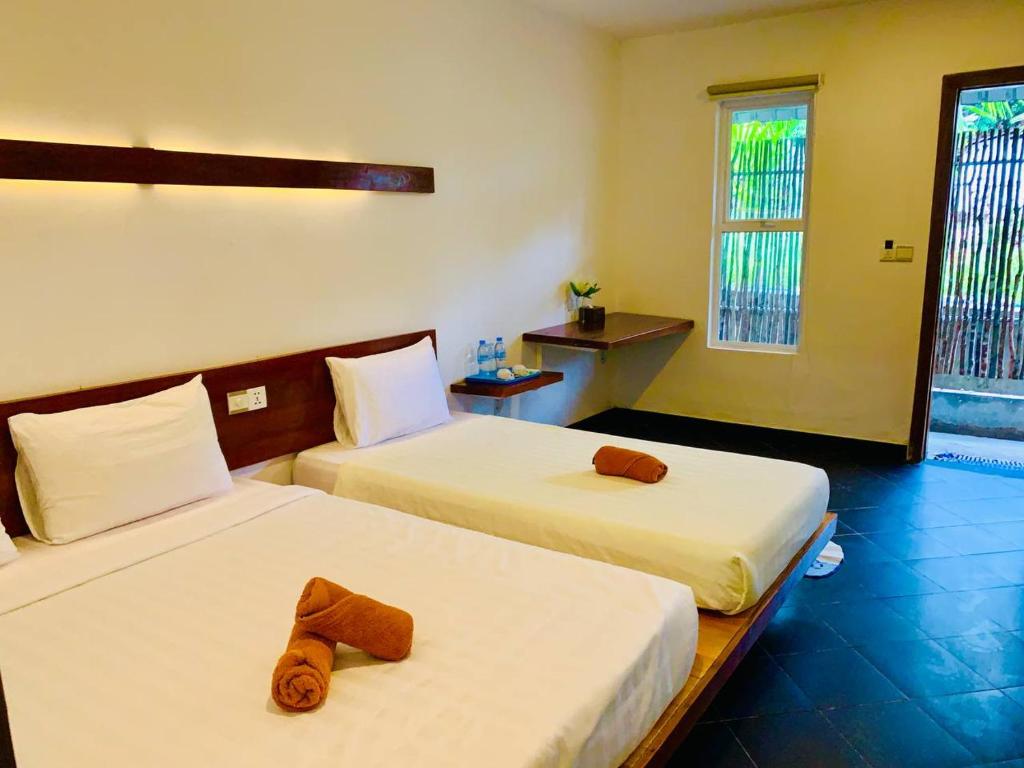 Postel nebo postele na pokoji v ubytování Onederz Koh Rong Sanloem