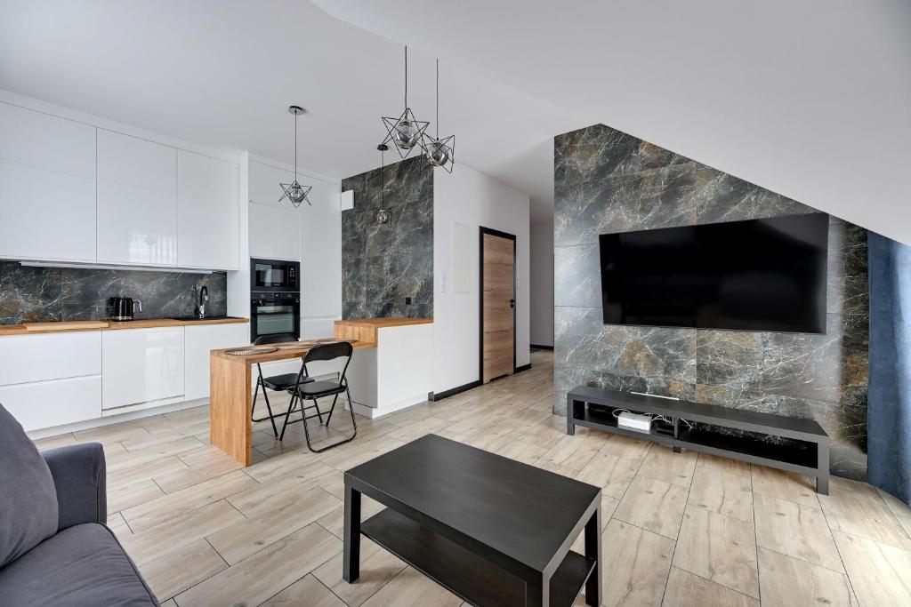 Televízia a/alebo spoločenská miestnosť v ubytovaní Lion Apartments - Botanica