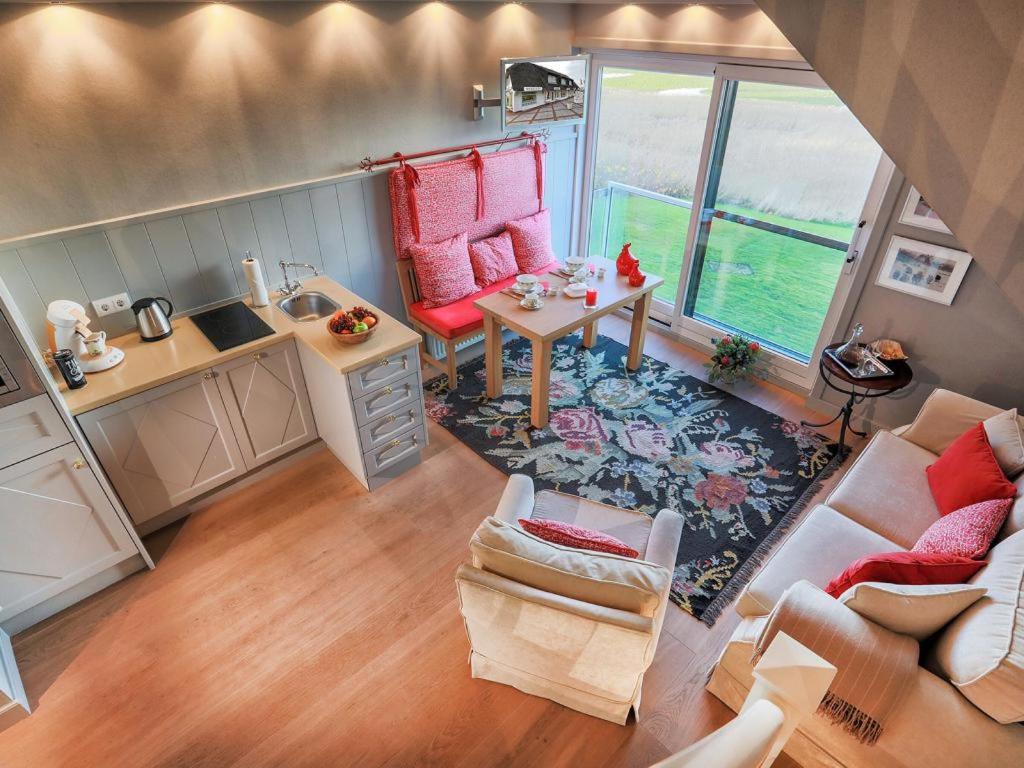 an aerial view of a living room with a couch and a table at Fernsicht in Morsum