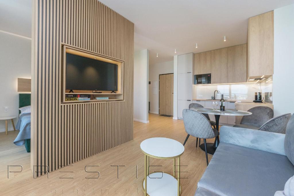 A television and/or entertainment center at Prestige Apartments Modern Tower Gdynia