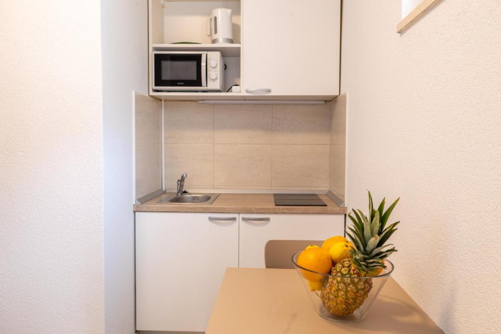 Kuchyňa alebo kuchynka v ubytovaní Vidoš apartments