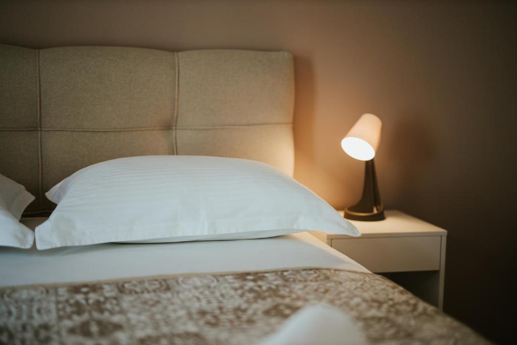 Posteľ alebo postele v izbe v ubytovaní Vidoš apartments