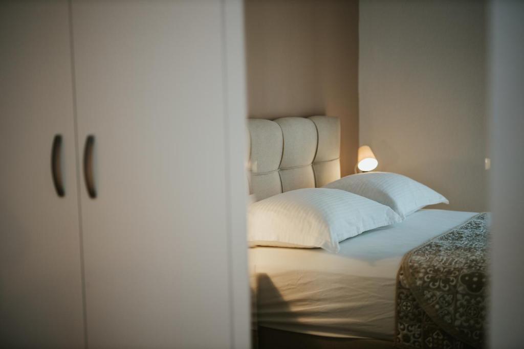 Posteľ alebo postele v izbe v ubytovaní Vidoš apartments
