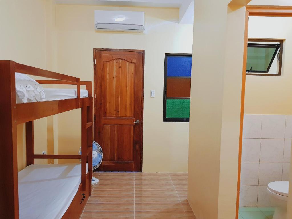 Postel nebo postele na pokoji v ubytování Pamujo Hostel