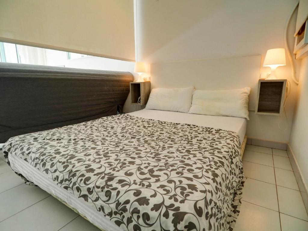 Posteľ alebo postele v izbe v ubytovaní Ferdinand Apartment by Hello Homes Sitges