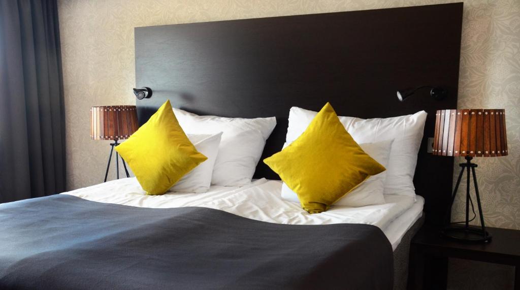 Postel nebo postele na pokoji v ubytování Home Hotel Plaza
