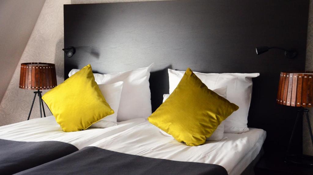 Postel nebo postele na pokoji v ubytování Home Hotel Plaza