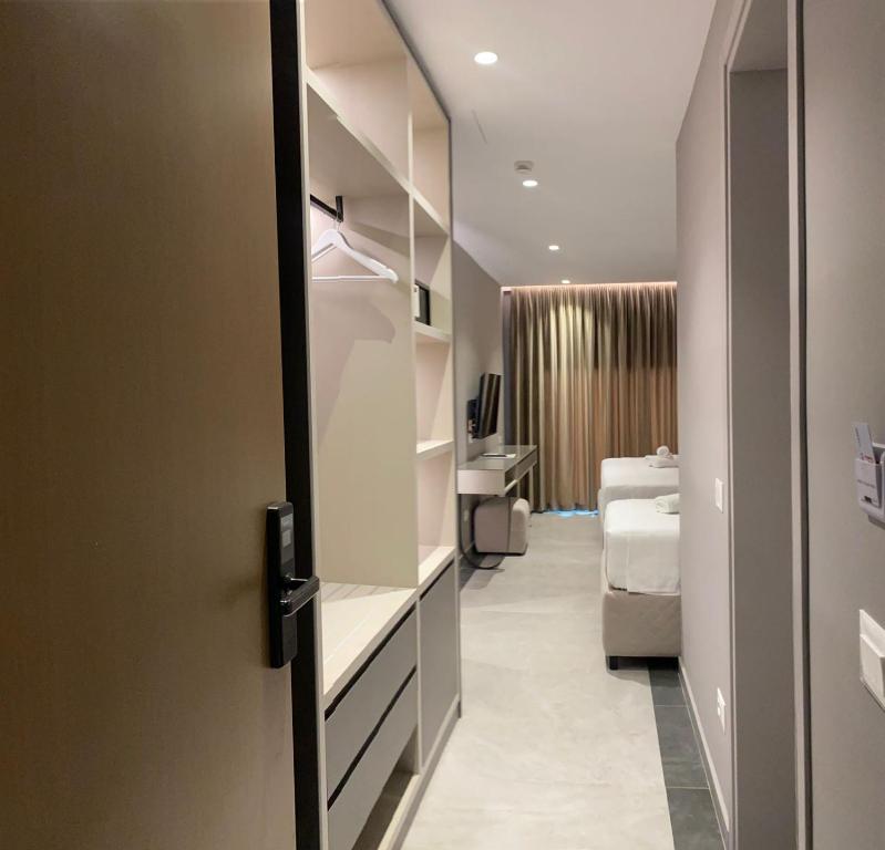 Postel nebo postele na pokoji v ubytování Hotel President