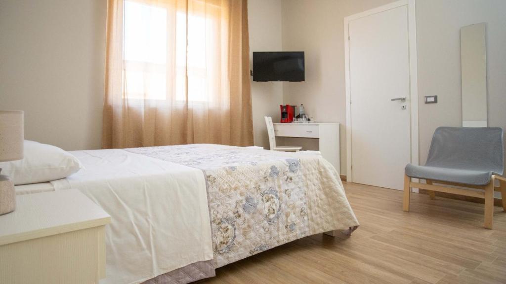 Łóżko lub łóżka w pokoju w obiekcie B&B Ercole Agrigento