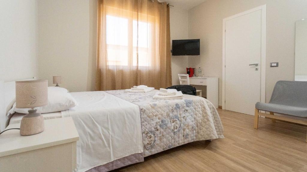 Łóżko lub łóżka w pokoju w obiekcie B&B Ercole Agrigento