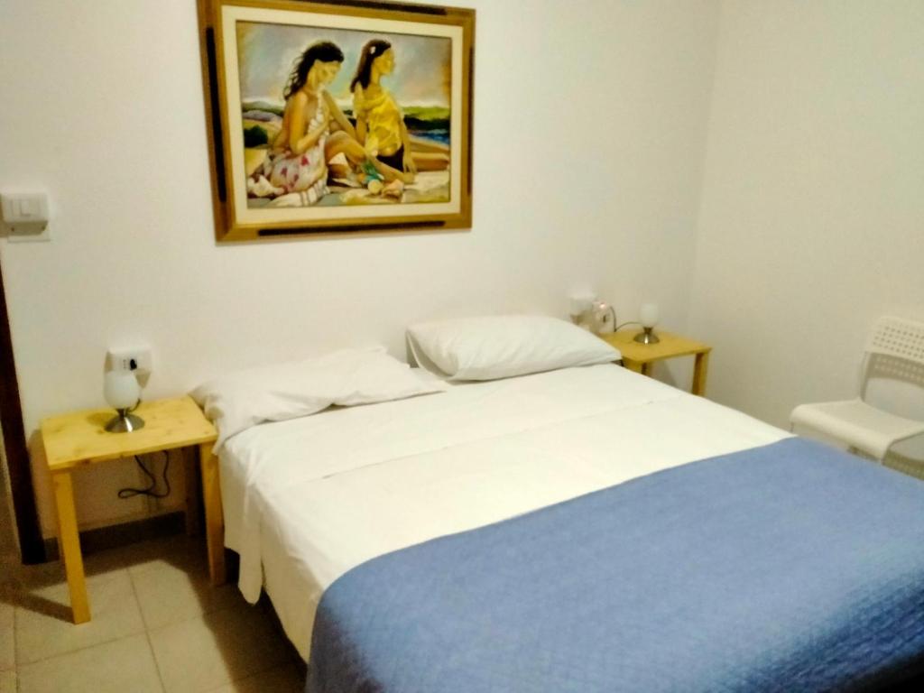 En eller flere senger på et rom på CASA DE NELLA