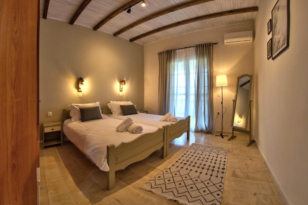 Postel nebo postele na pokoji v ubytování Villa Doreta