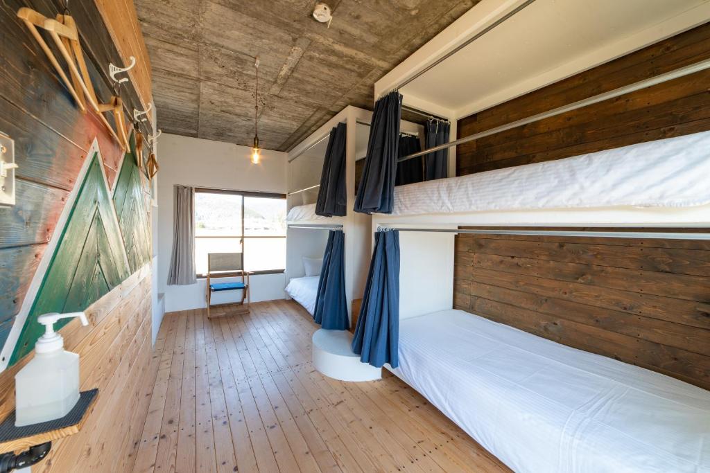 Postel nebo postele na pokoji v ubytování Ichi The Hostel