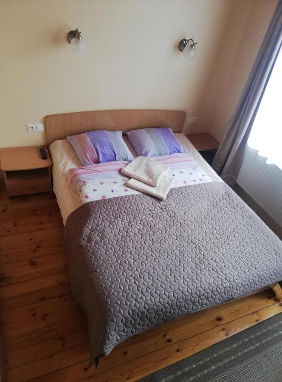 Postel nebo postele na pokoji v ubytování Inkliuzas