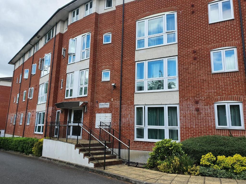 a brick building with a staircase in front of it at global relocation 2 Bed Apt Near Hatfield Station Free Parking in Hatfield